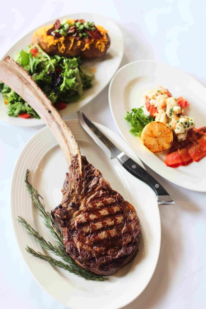 Tomahawk and Lobster scaled Mickey Mantle's Steakhouse